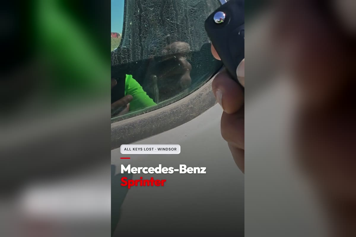 A new chrome-sided Mercedes-Benz Sprinter flip key held up to the driver window of a white NCV3 Sprinter van during an all-keys-lost job near Metro on Howard in Windsor, from the Canadian Locksmiths TikTok
